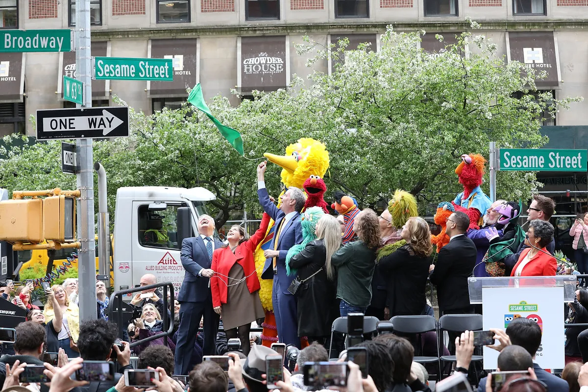 Bill de Blasio and the cast and crew of Sesame Street attend the Sesame Street sign unveiling on May 1, 2019 on the Upper West Side in New York City. 