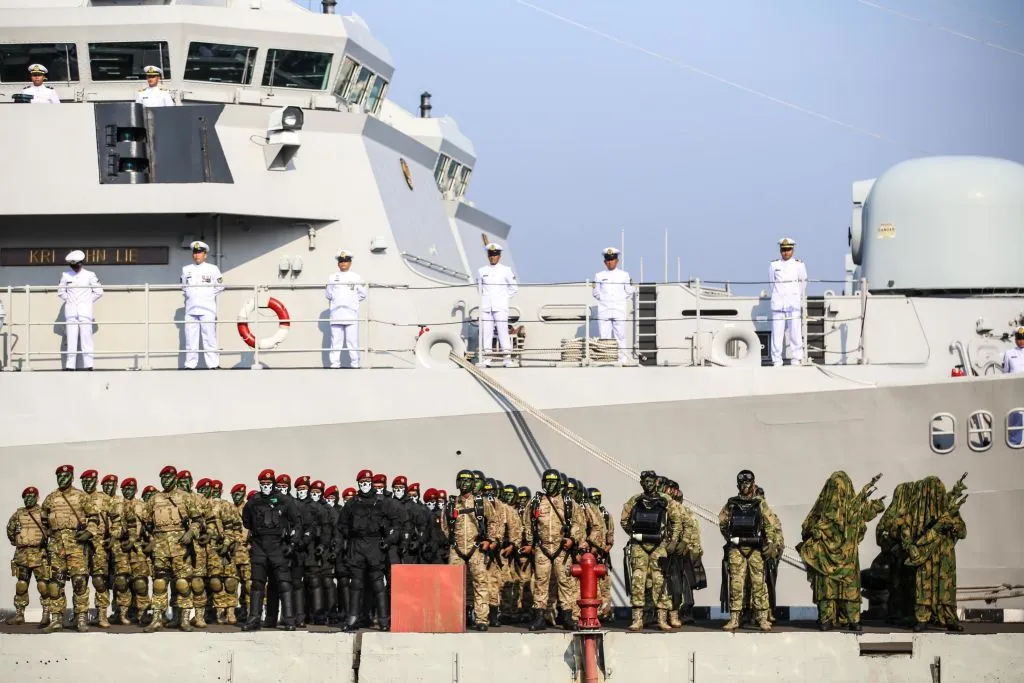 Indonesia's army forces stand in formation prior to a military parade for celebrations of the 73nd anniversary of the Indonesia navy military