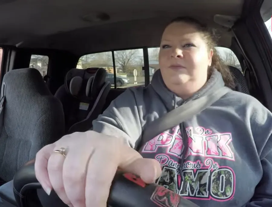 sabrina archey driving a car