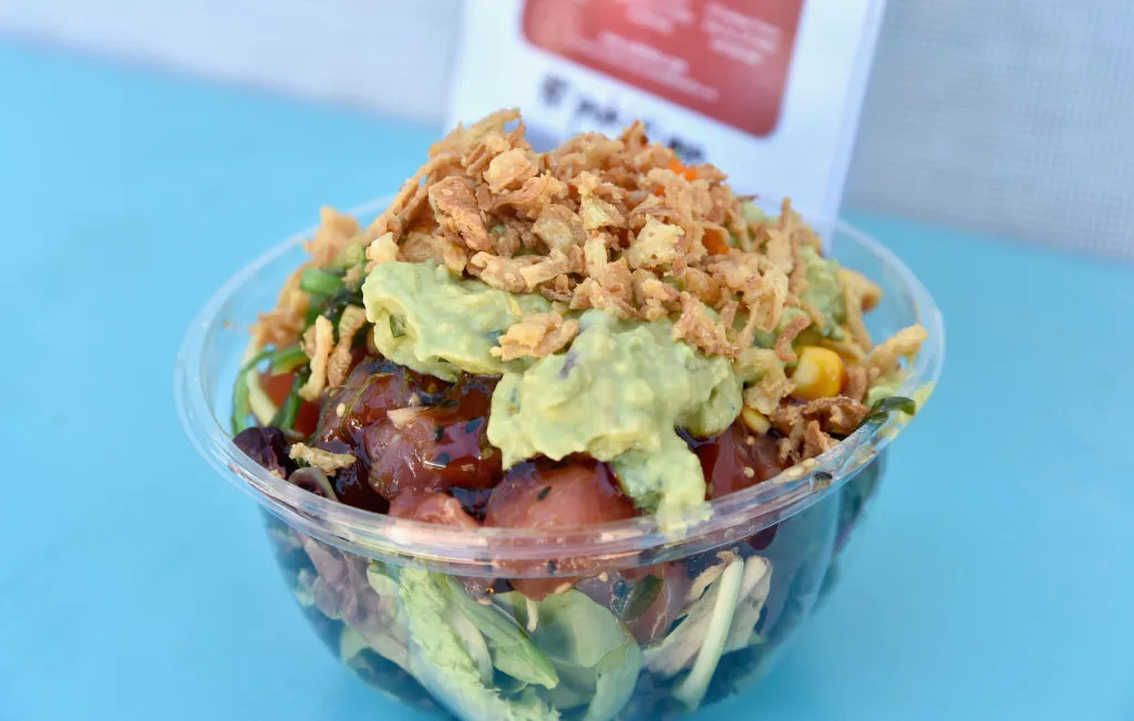 poke bowl with tuna, lettuce, avocado, and crispy noodles