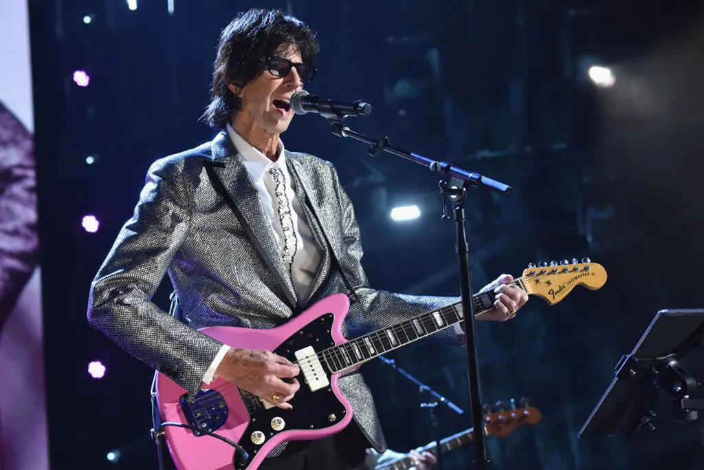 Ocasek playing guitar