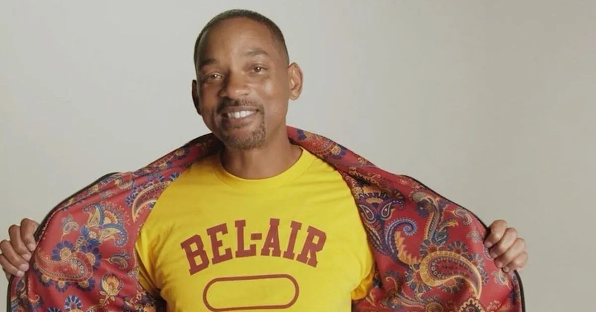 Will Smith models his merch including the reversible paisley jacket and a yellow Bel-Air shirt