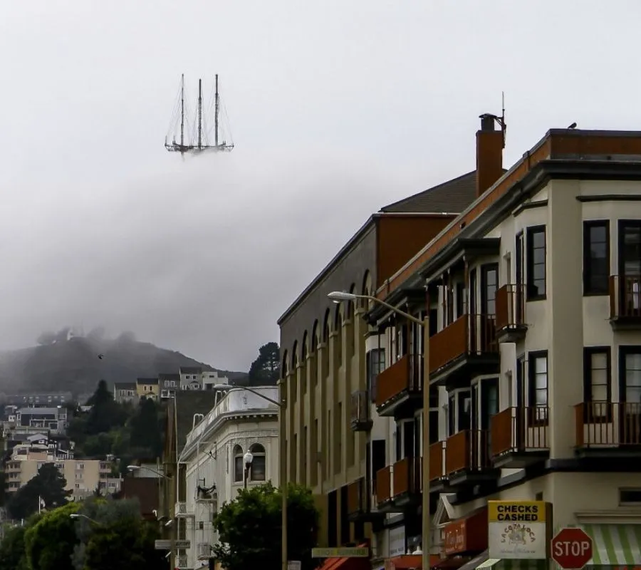 a tower that looks like it's a ship in the clouds