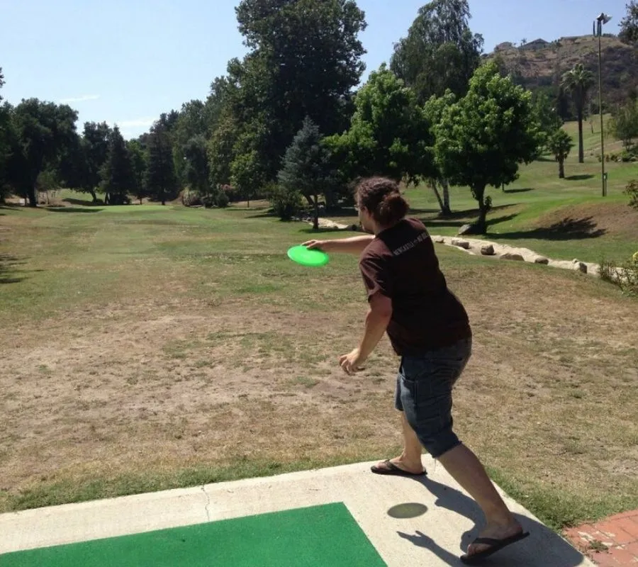 a picture of someone throwing a frisbee