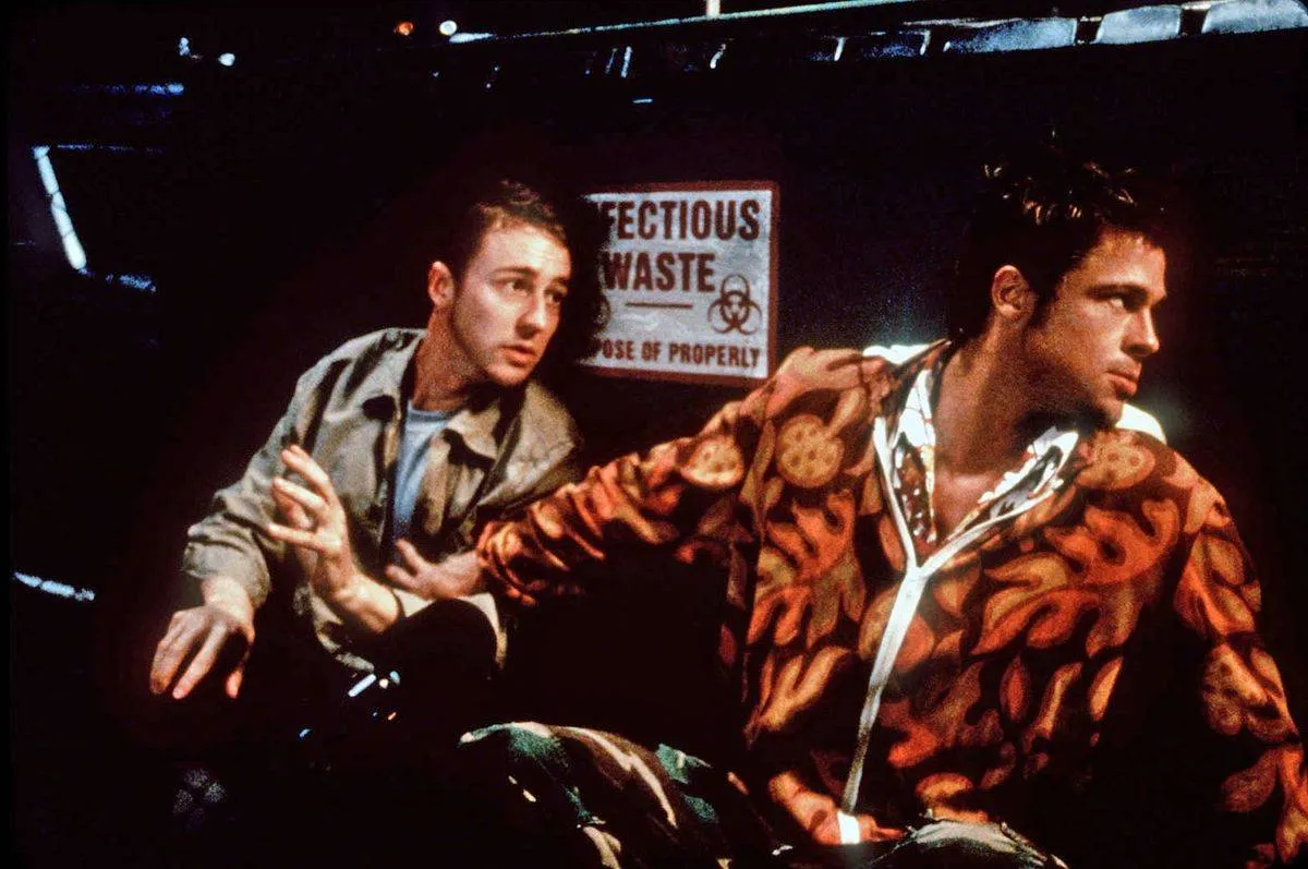 brad pitt and edward norton sitting by a dumpster