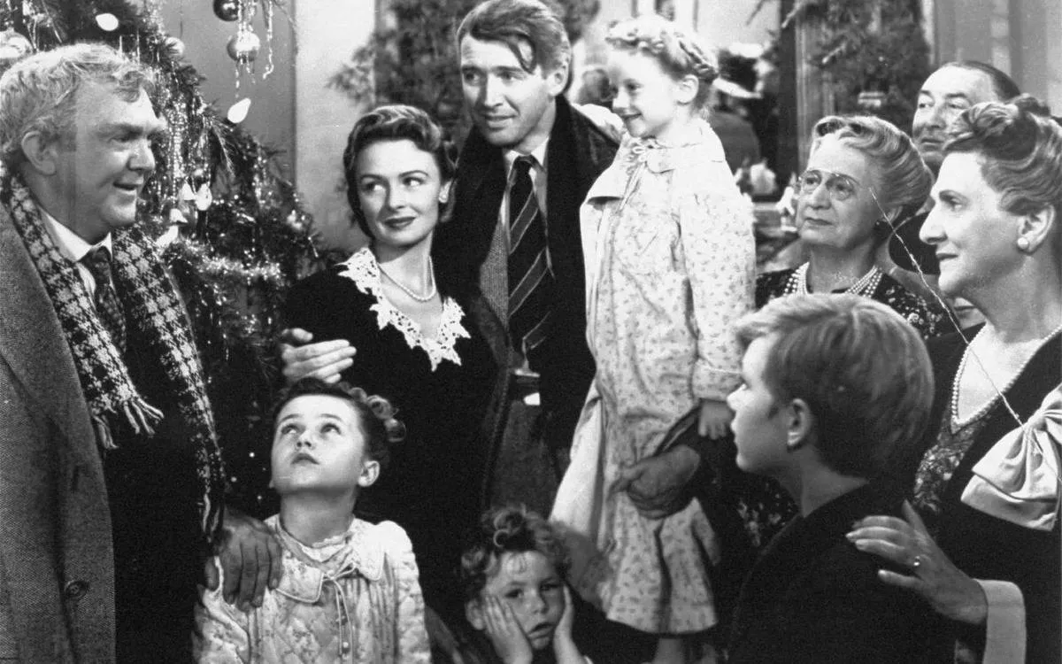 the cast of it's a wonderful life in a black and white still from the movie