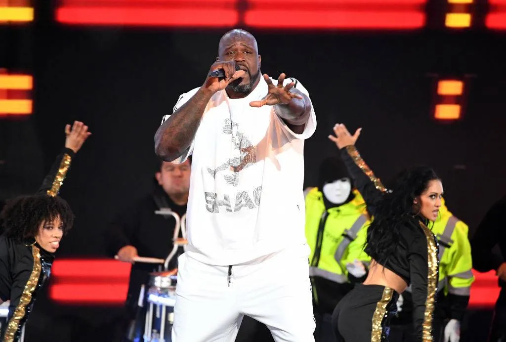 Shaq rapping at a concert